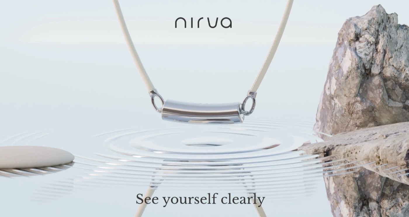 The curved silver Nirva module suspended from a necklace